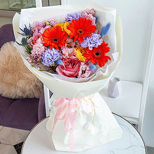Gerbera daisies - 3, Lilac carnation - 7, Pink rose Pink X-pression 50 cm - 3, Pink Lisianthus (Eustoma) - 2, Spray rose: yellow, orange 50 cm - 2, Waxflower (1 pc.), Dried flowers in assortment, Eryngium, Eucalyptus, Wrapping Paper