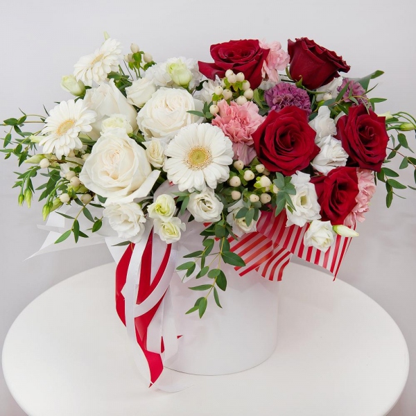 White rose 50 cm - 4, Red rose 50 cm - 7, Carnation white, cream - 3, lisianthus - 4, Gerbera white - 4, Pink carnation - 4, Lilac carnation - 4, Round flower box small , Oasis, Wrapping Paper, Hypericum, Eucalyptus parvifolia (1 pc.), Aspidistra (1 pc.)