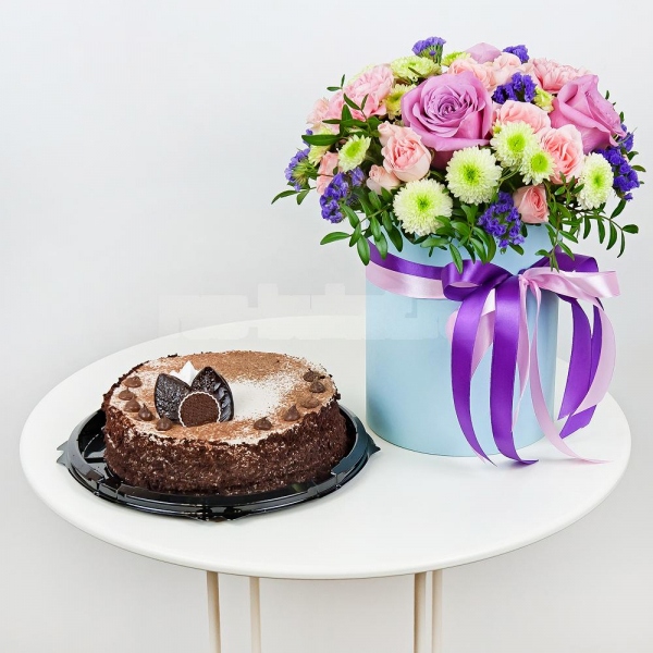 Deep Purple rose - 4, Santini White Spray Chrysanthemum - 4, Pink carnation - 4, Bright pink spray rose mix, 50 cm - 7, Round flower box small , Oasis, Pistachio, Film, Blue Statice, Ribbon, Cake in assortment