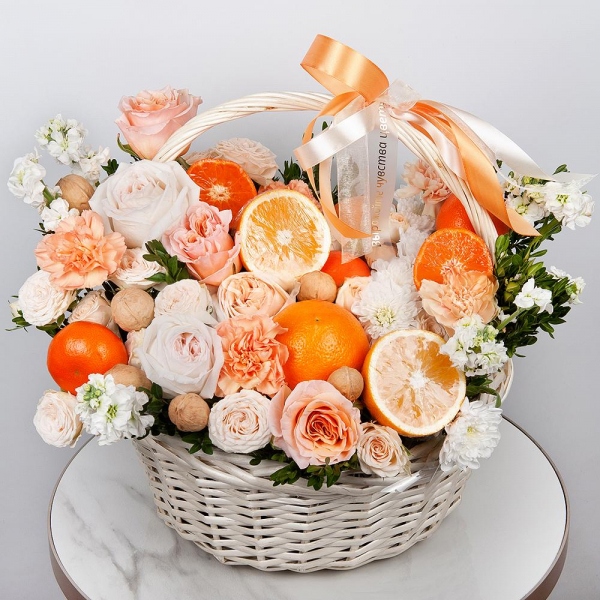 Cream Rose 50 cm Ecuador (Creme Caramel) - 3, Peony style roses - 3, Orange carnation - 8, White Matthiola - 5, Baltica White Spray Chrysanthemum - 2, Peony sprayrose - 3, Carnation white, cream - 9, Large Basket, Oasis, Pistachio, Orange, Tangerine, 1 pc., Walnut (10 pieces), Wooden skewer, Ribbon, Walnut (10 pieces)