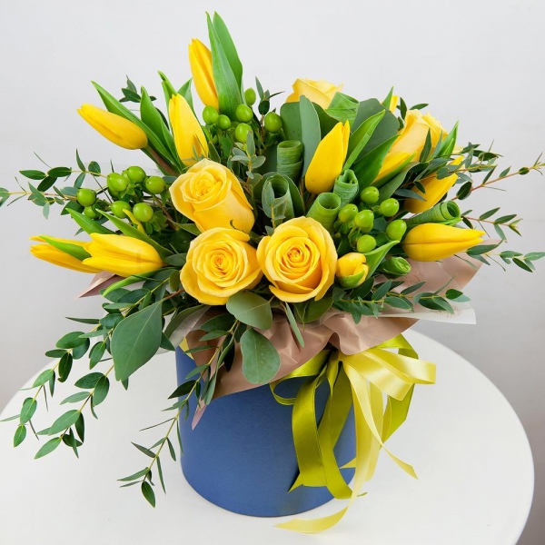 Yellow rose 50 cm - 7, Yellow tulip - 13, Round flower box small , Oasis, Wrapping Paper, Ribbon, Hypericum, Eucalyptus parvifolia (1 pc.), Eucalyptus populus (1 pc.)