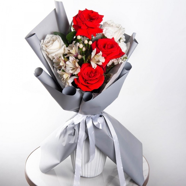 Red rose Nina 50 cm - 4, White rose 50 cm Ecuador - 3, Alstromeria white, soft pink - 2, White spray carnation - 1, Hypericum, Ruscus, White statice, Wrapping Paper