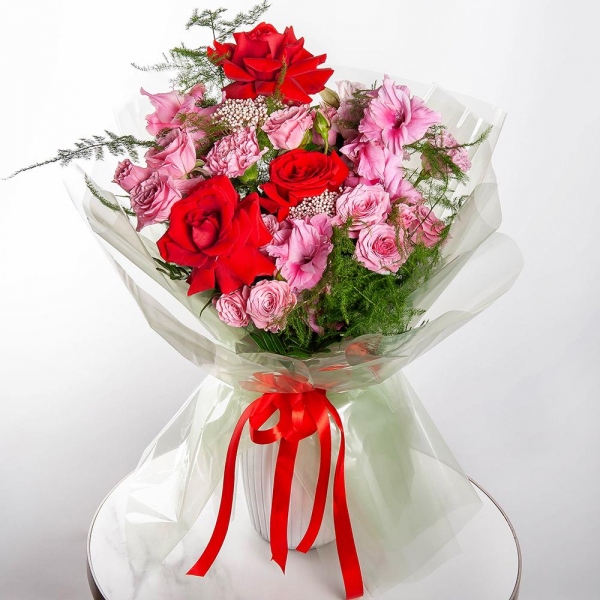 Red rose Nina 50 cm - 7, Spray rose: white, cream, light pink 50 cm - 4, Pink Gladiolus - 3, Pink Lisianthus (Eustoma) - 3, Pink carnation - 7, Ozotamnus, Asparagus setaceus (1 pc.), Wrapping Paper