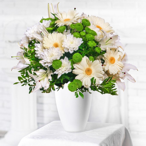 Lilies - 4, Athos pom Feeling Green - 3, Baltica White Spray Chrysanthemum - 4, Gerbera white - 7, Pistachio, Mesh (Abaka), Ribbon