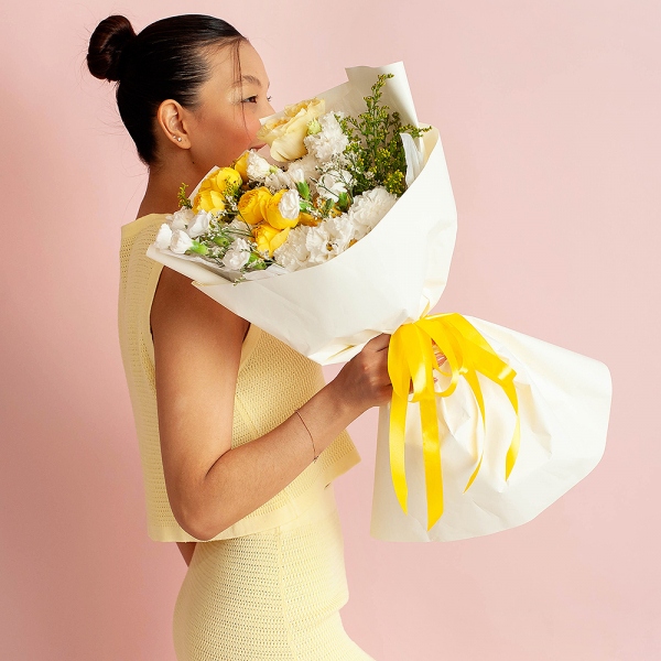 Spray rose: yellow, orange 50 cm - 2, lisianthus - 3, Carnation white, cream - 5, White spray carnation - 5, Rose Yellow 50 cm Ecuador (Mohana, Latina, Brighton) - 1, Solidago (1 pc.), Limonium (1 pc.), Wrapping Paper