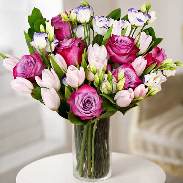Deep Purple rose - 9, Tulip white - 20, Purple Lisianthus (Eustoma) - 4, Ruscus, Wrapping Paper