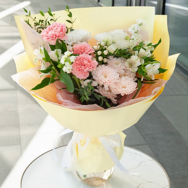Pink carnation - 7, White Matthiola - 2, Baltica White Spray Chrysanthemum - 2, Alstromeria white, soft pink - 5, lisianthus - 1, Hypericum, Eucalyptus parvifolia (1 pc.), Wrapping Paper