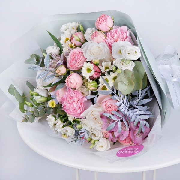 Santini White Spray Chrysanthemum - 4, Alstromeria white, soft pink - 3, Pink carnation - 3, White rose 50 cm - 4, Peony sprayrose - 3, lisianthus - 3, Pistachio, Eucalyptus Cinerea, Wrapping Paper