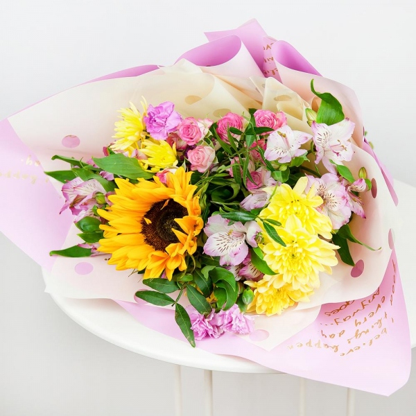 Sunflower - 1, Baltica Yellow Spray Chrysanthemum - 3, Alstromeria white, soft pink - 4, Pink spray carnation - 3, Bright pink spray rose mix, 50 cm - 2, Pistachio, Wrapping Paper