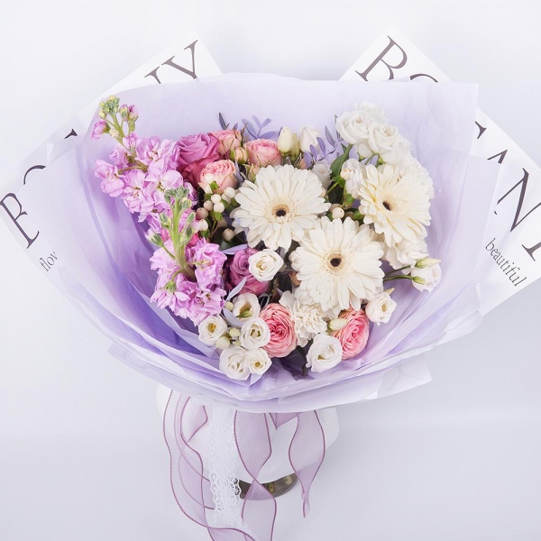 Gerbera white - 3, Pink rose 50 cm - 5, Peony sprayrose - 3, Carnation white, cream - 4, Matthiola Lilac - 2, lisianthus - 3, Hypericum, Pistachio, Wrapping Paper