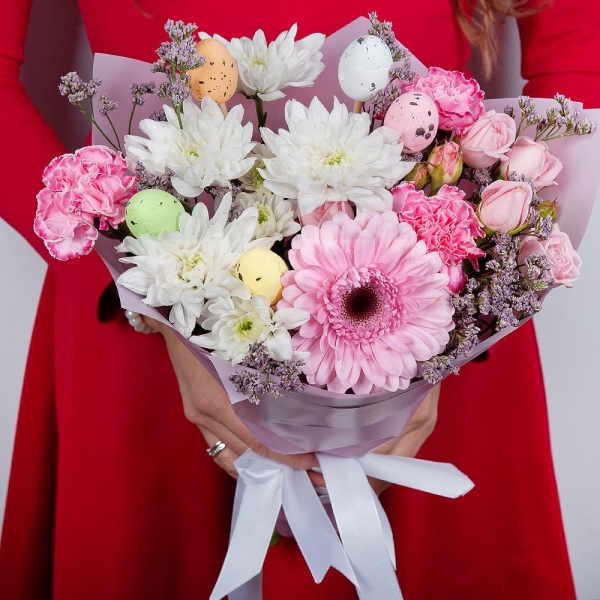 Bright pink spray rose mix, 50 cm - 2, Baltica White Spray Chrysanthemum - 1, Gerbera pink - 1, Pink carnation - 4, Limonium (1 pc.), Easter eggs (3 pc.), Wrapping Paper, Ribbon