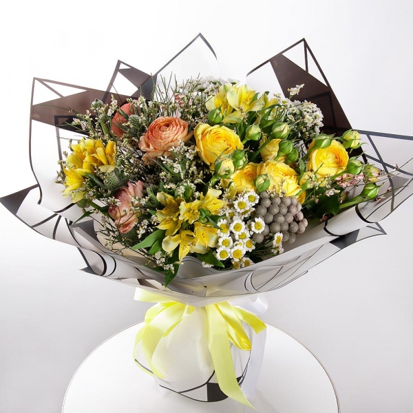 Peony sprayrose - 3, Ranunculus Pink - 3, Alstromeria Yellow, Orange - 7, Santini White Spray Chrysanthemum - 5, Brunia Green Lanuginosa (1 pc.), Eryngium, Limonium (1 pc.), Genista, Wrapping Paper