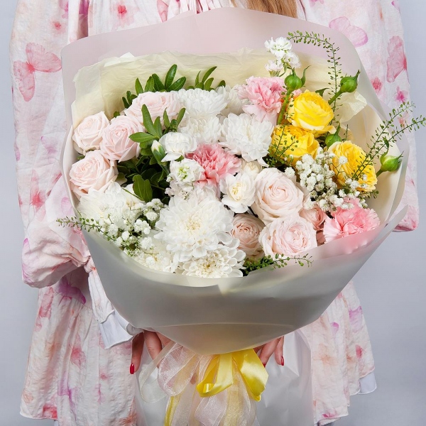 Baltica White Spray Chrysanthemum - 2, Peony sprayrose - 2, Pink carnation - 7, White spray carnation - 2, White Matthiola - 2, Gypsophila - 1, Spray rose: yellow, orange 50 cm - 1, Pistachio, Green bell (1 pc.), Wrapping Paper