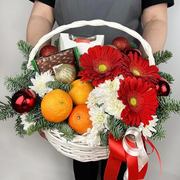 Gerbera red - 3, Baltica White Spray Chrysanthemum - 3, Medium Basket, Oasis, Spruce branches (1pc.), Tangerine, 1 pc., Chocolate Ritter Sport 100g, Box of candies «Raffaello» 150 g, Ribbon, Christmas decor (set)